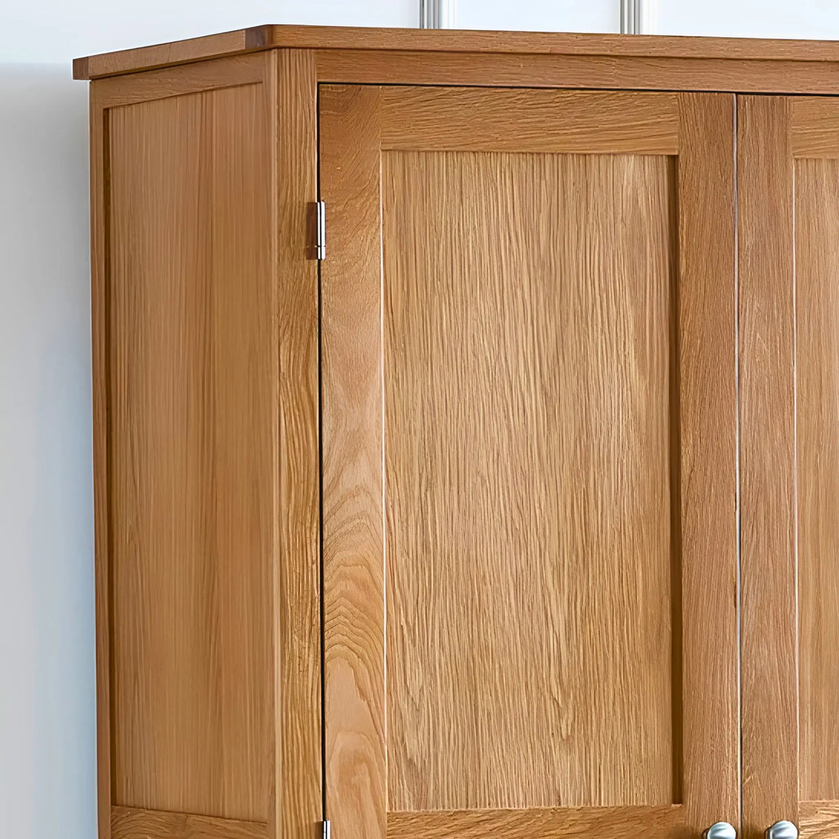 Oak wooden cabinet close-up showing upper doors