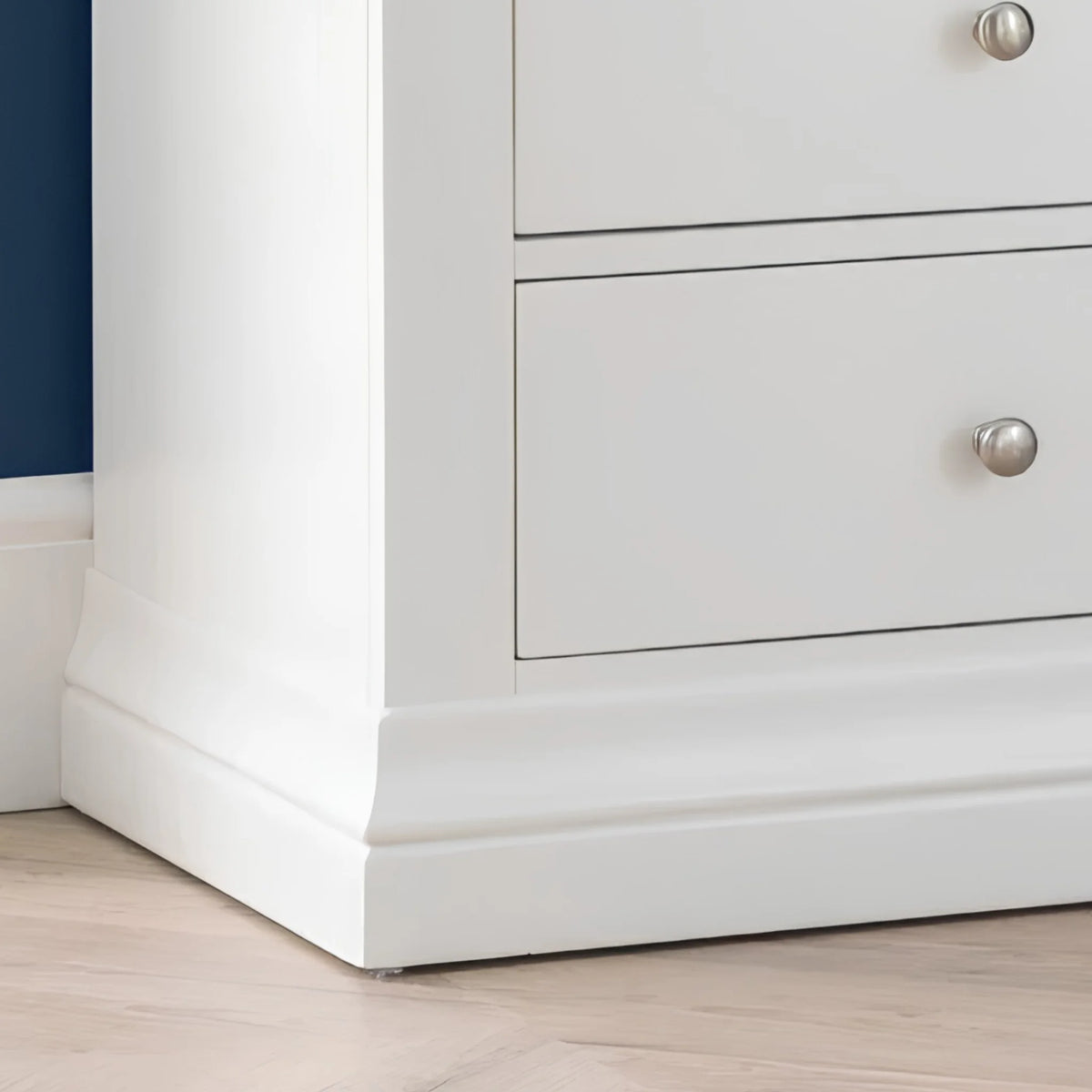 Clermont White Wooden 7-Drawer Chest – bottom corner close-up