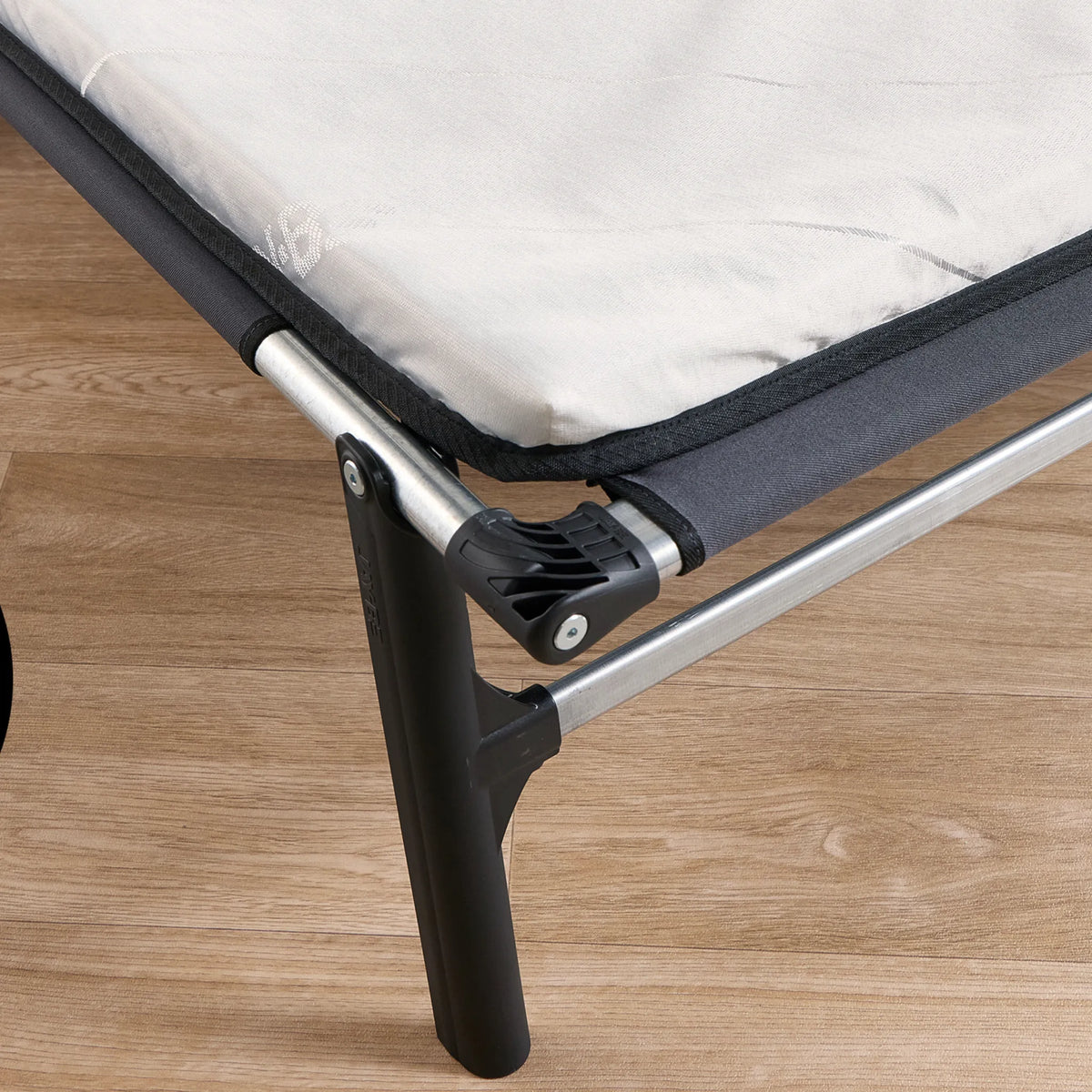 Compact Folding Bed with Comfort Mattress – close-up of corner hinge and mattress
