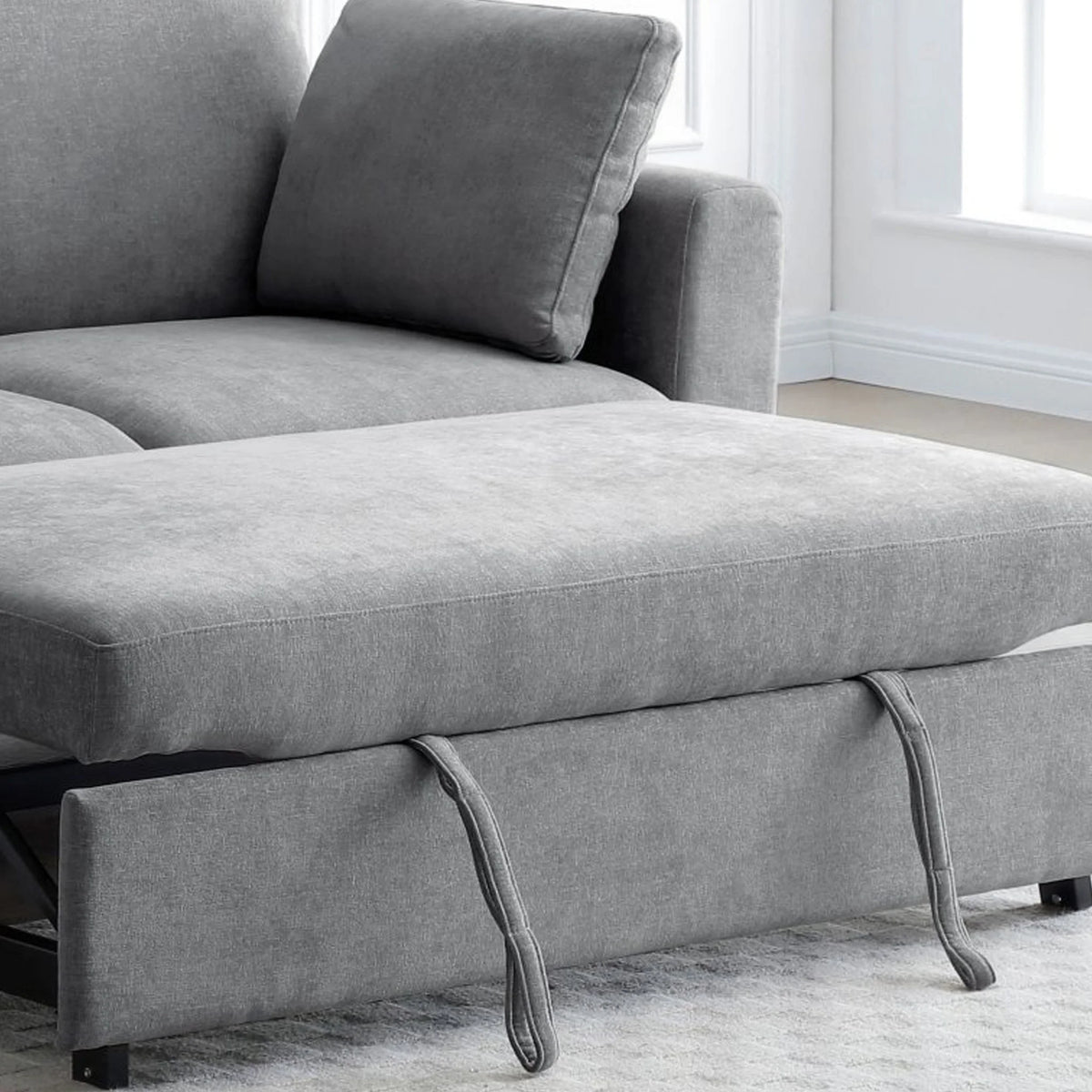Sorrento Grey Sofa Bed – close-up of textured fabric and sleeper mechanism pull-tabs
