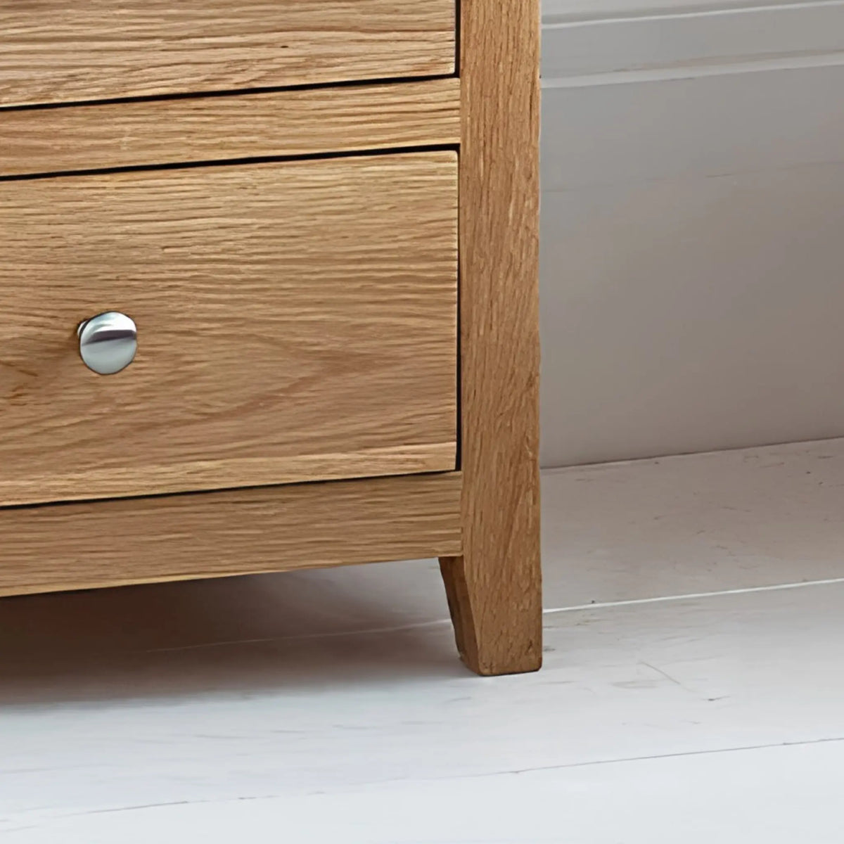 Mallory Oak 7-Drawer Chest – close-up of bottom drawer and wooden leg