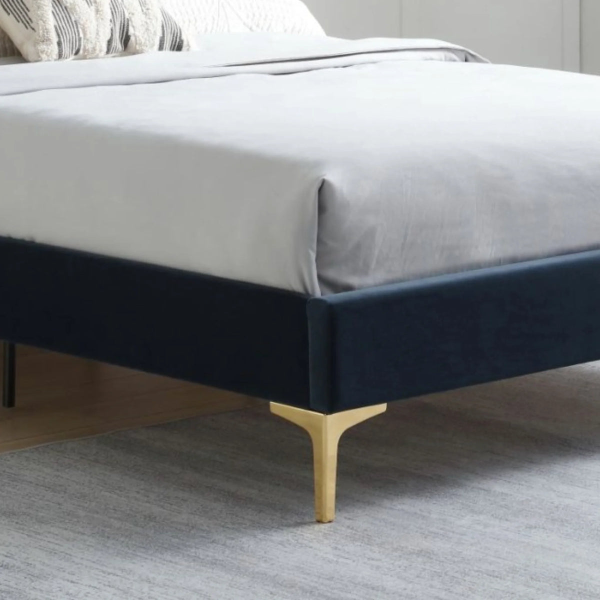 Avery Navy Velvet Bed – footboard and gold legs close-up