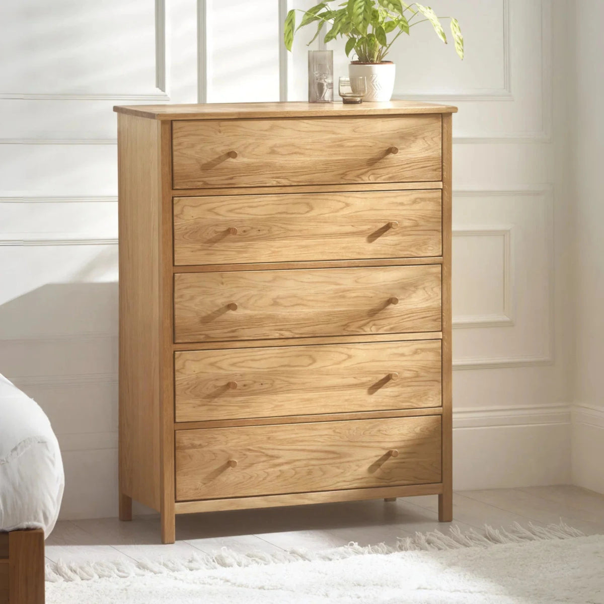 Coxmoor Oak 5-Drawer Chest – front view with top surface decor