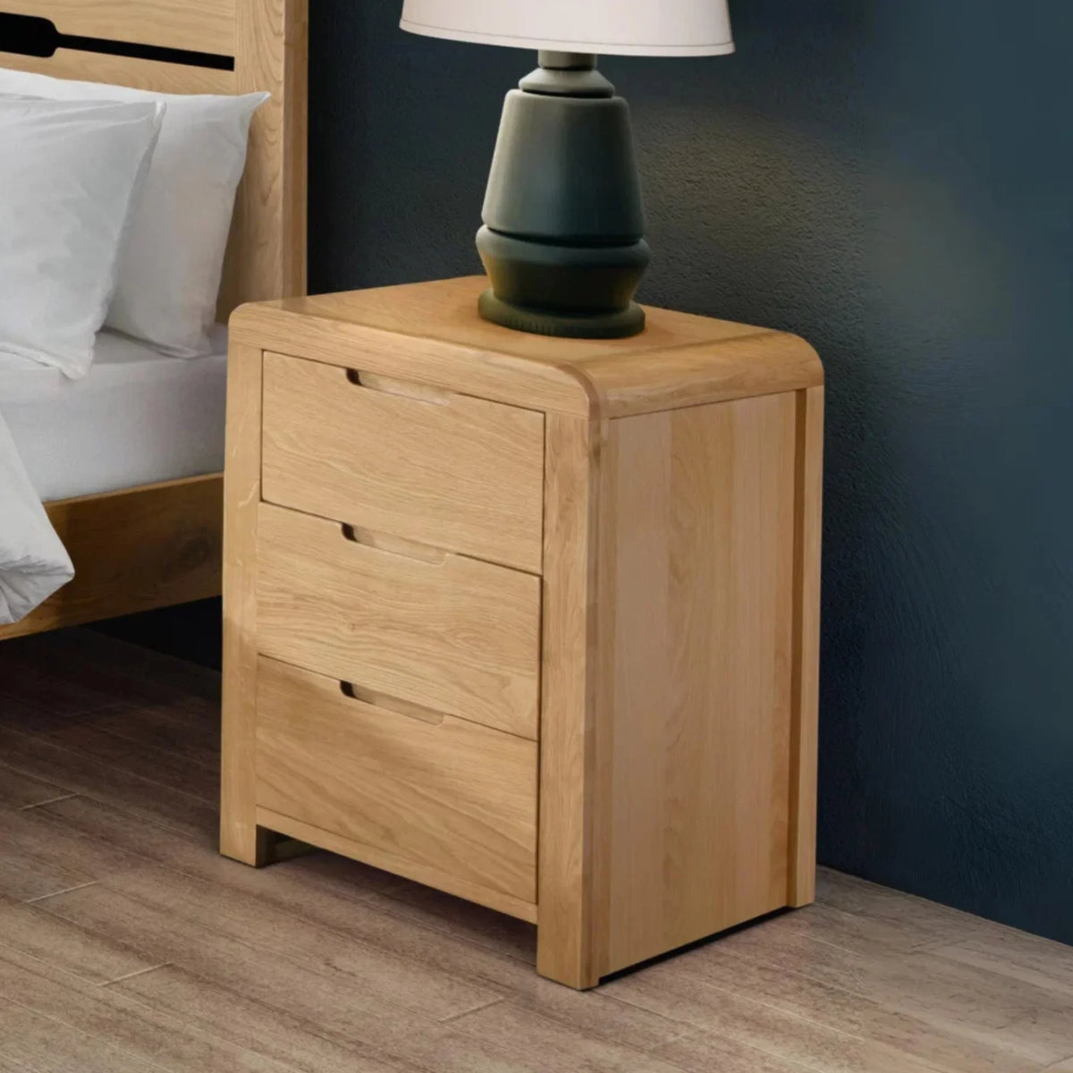 Curve Oak 3-Drawer Bedside Chest – angled front and side view 