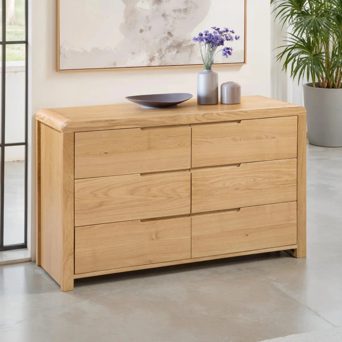 Curve Oak 6-Drawer Chest – angled front and side view in room setting