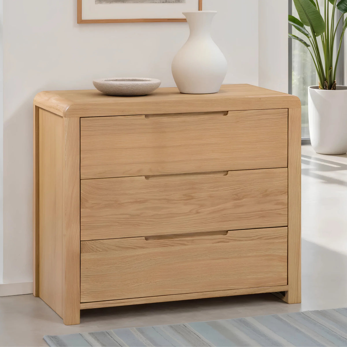 Curve Oak 3-Drawer Chest – angled front and side view in room setting